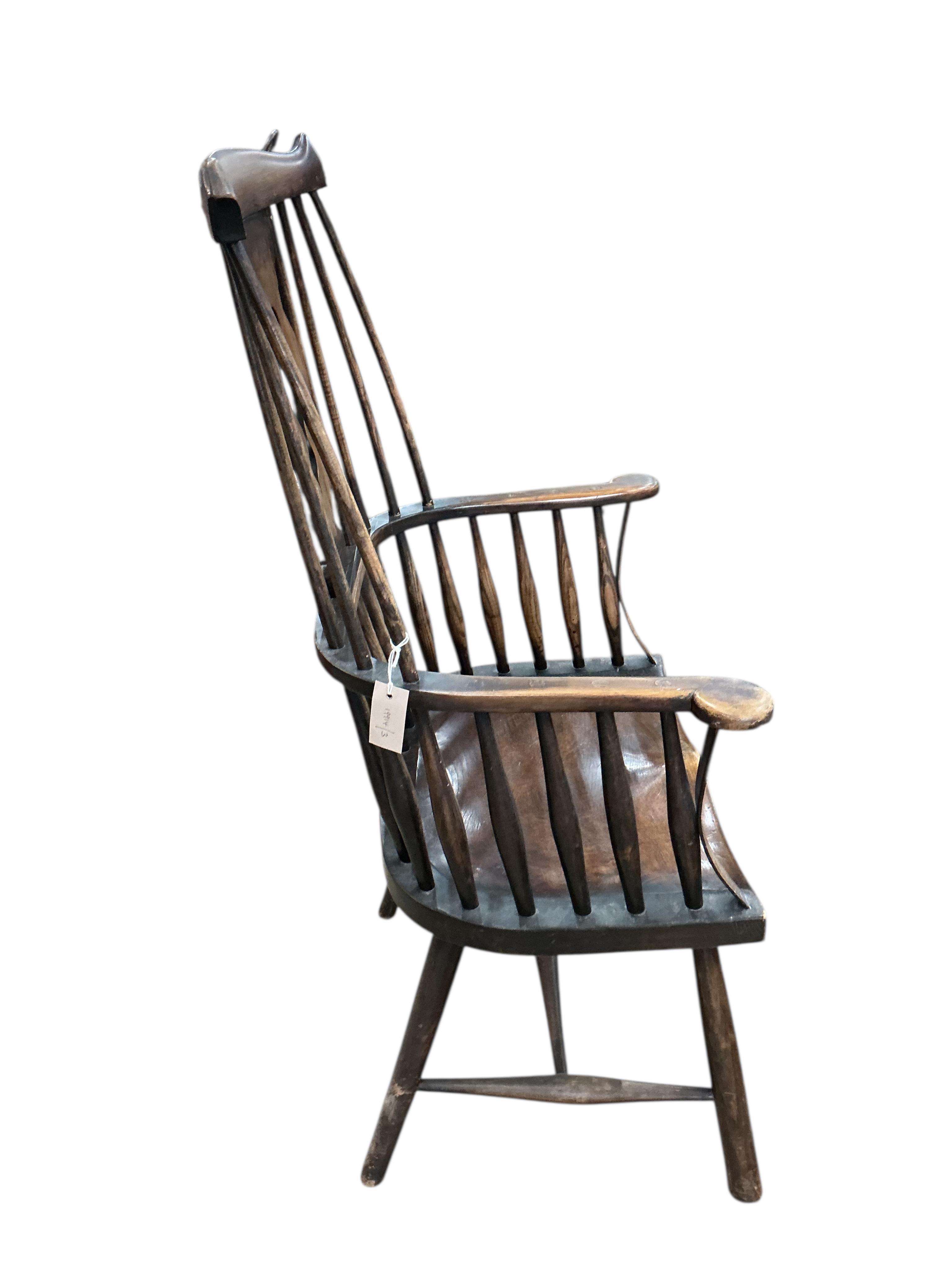 An early 20th century elm and beech Windsor armchair, width 66cm, depth 41cm, height 117cm